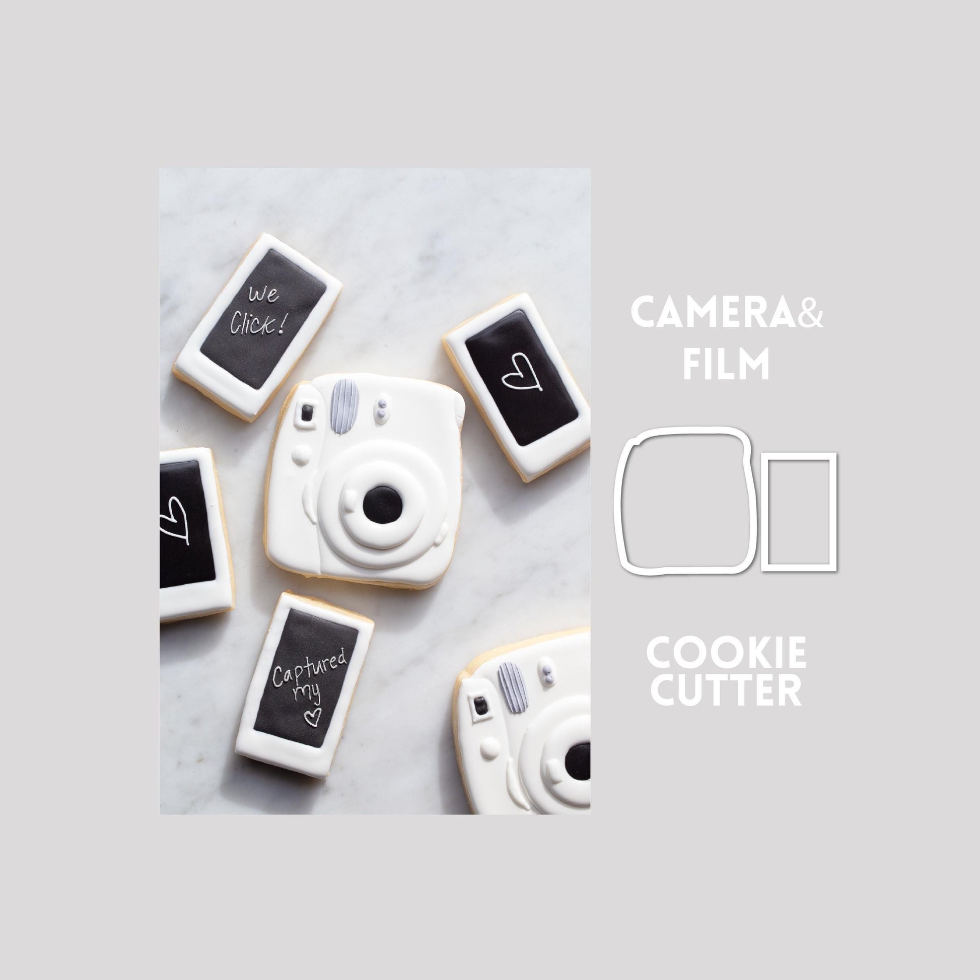 Decorated camera and film sugar cookie next to a camera and film cookie cutter outline on a gray background.