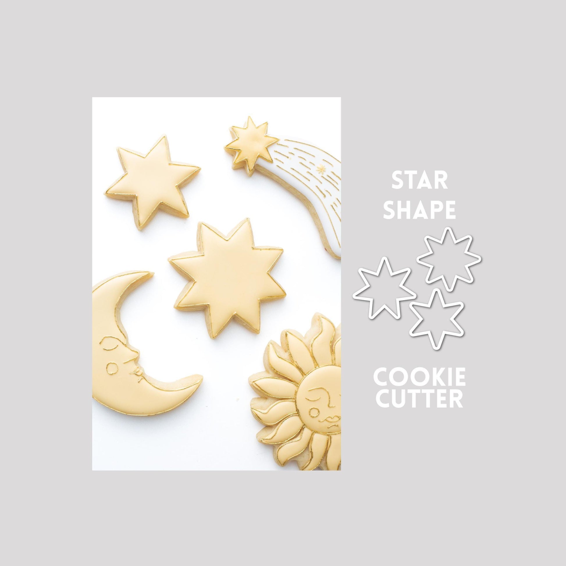 Decorated star shape sugar cookie next to a star shape cookie cutter outline on a gray background.