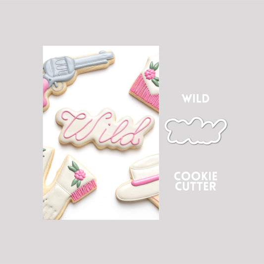 Decorated wild sugar cookie next to a wild cookie cutter outline on a gray background.