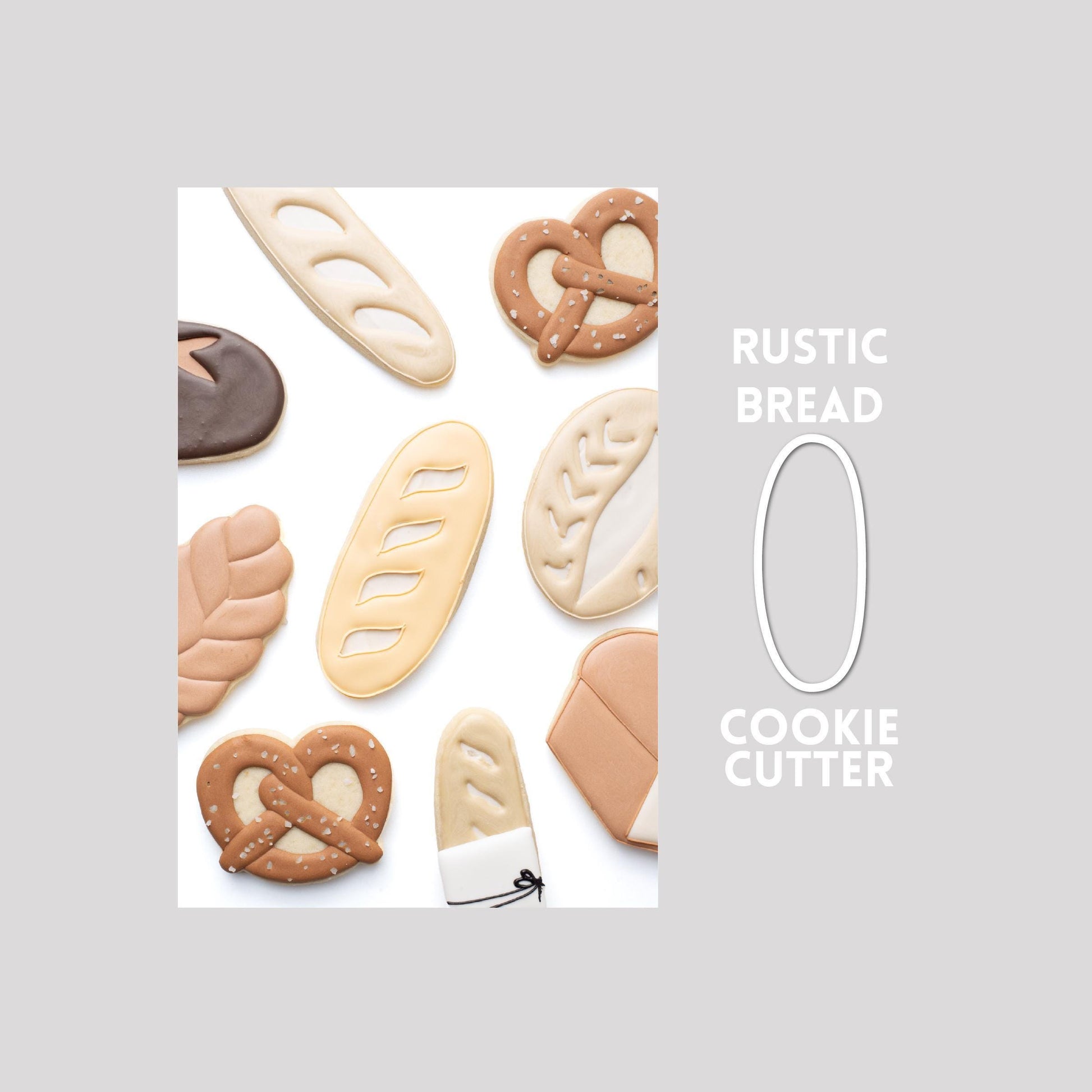 Decorated rustic bread sugar cookie next to a rustic bread cookie cutter outline on a gray background.