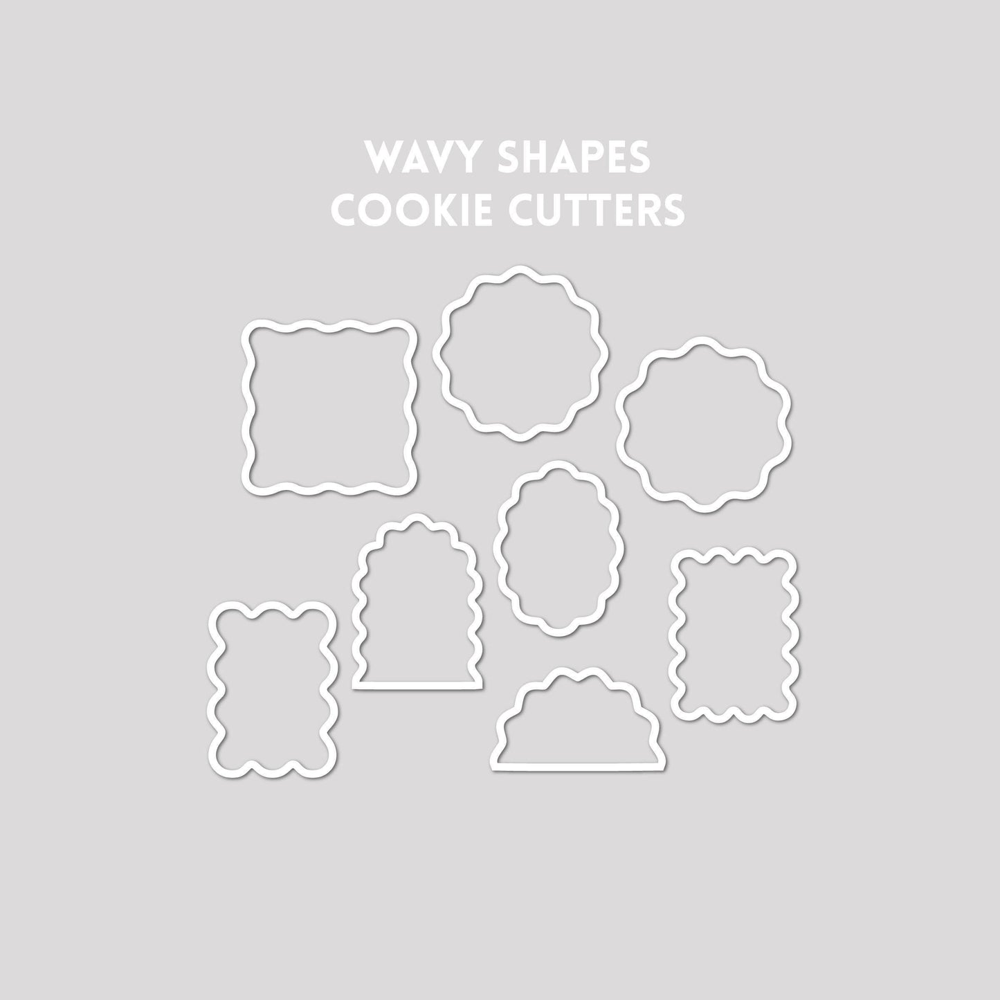 Various wavy shaped cookie cutter outline on a gray background.