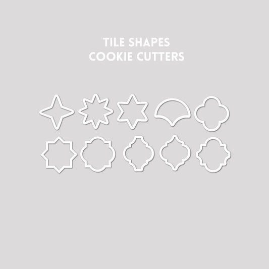 Various tile shaped cookie cutter outlines on a gray background.