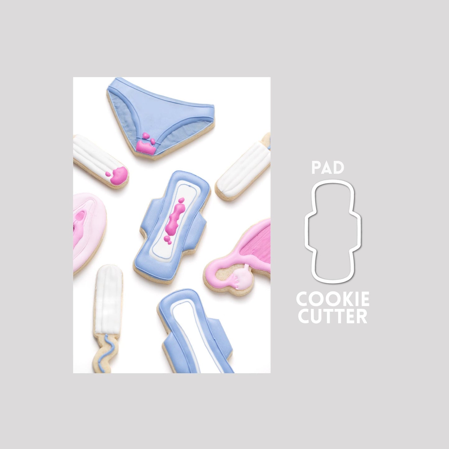 Decorated pad sugar cookie next to a pad cookie cutter outline on a gray background.