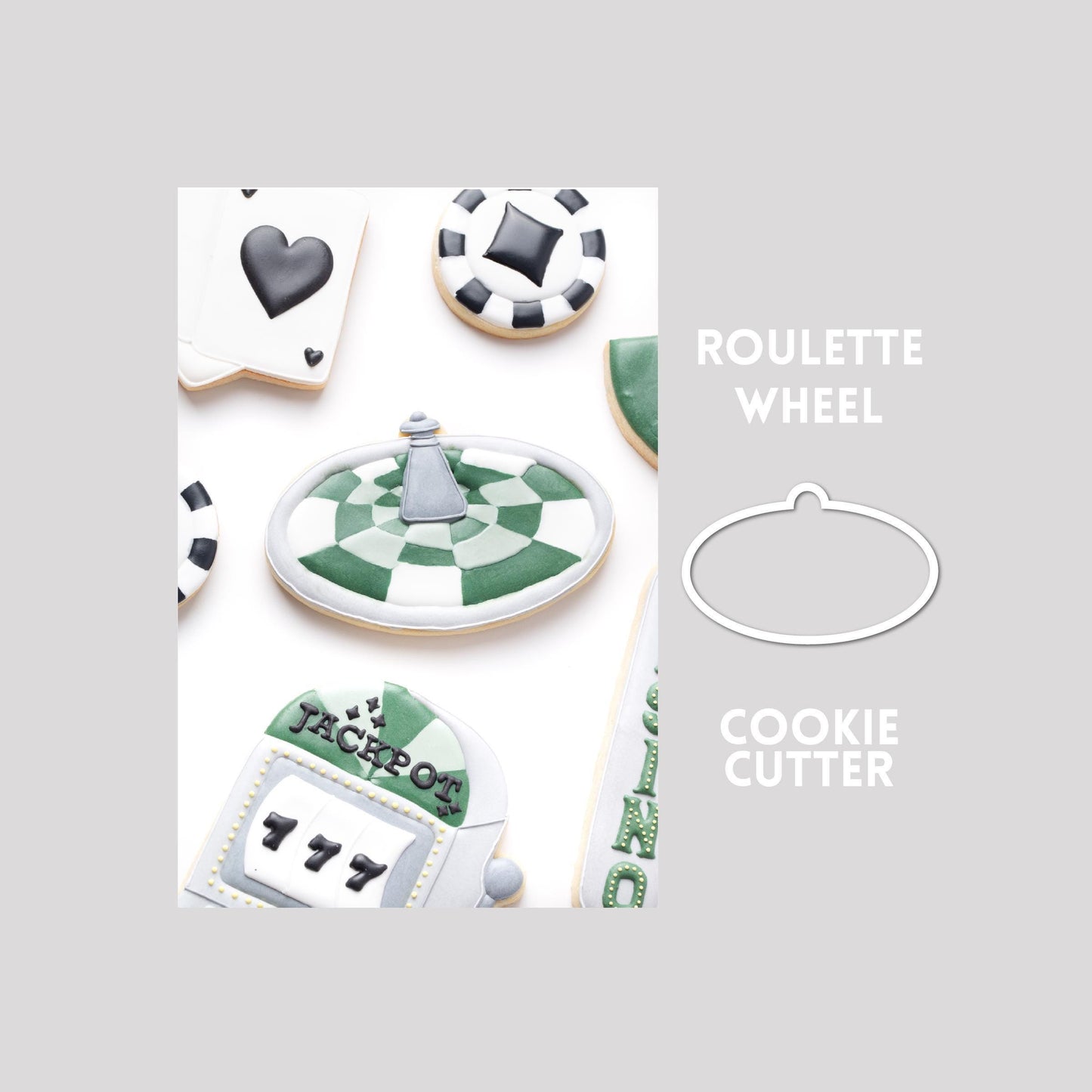 Decorated roulette wheel sugar cookie next to a roulette wheel cookie cutter outline on a gray background.