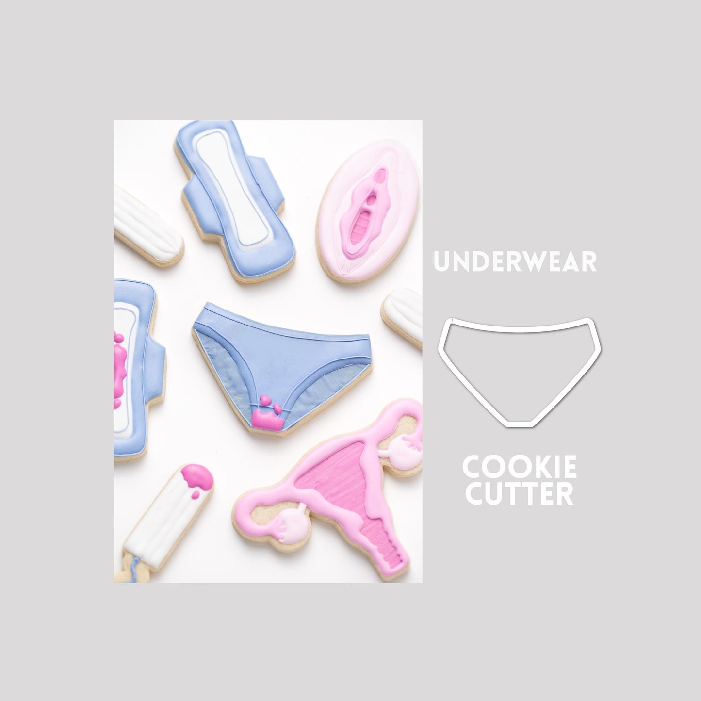 Decorated underwear sugar cookie next to a underwear cookie cutter outline on a gray background.