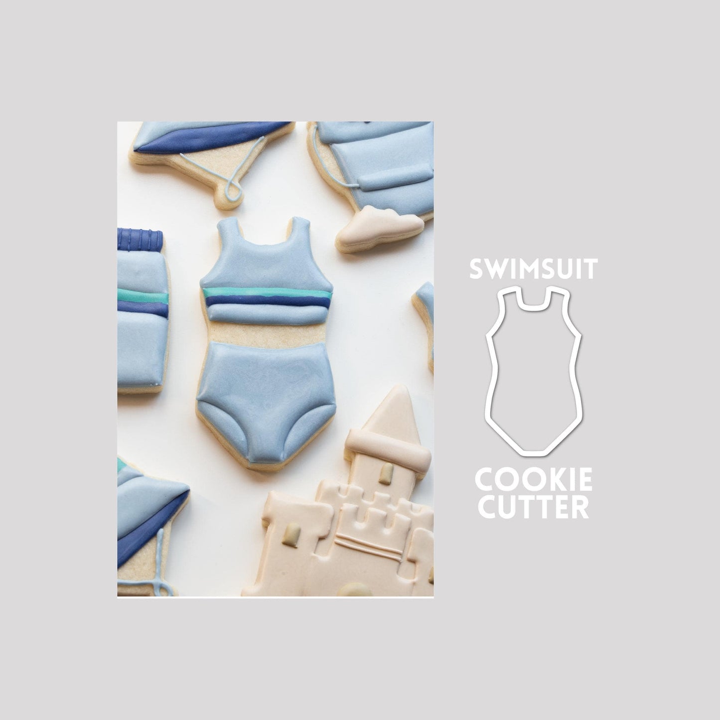 Decorated swimsuit sugar cookie next to a swimsuit cookie cutter outline on a gray background.