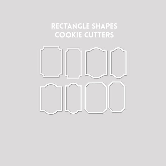 Various rectangle shaped cookie cutter outlines on a gray background.
