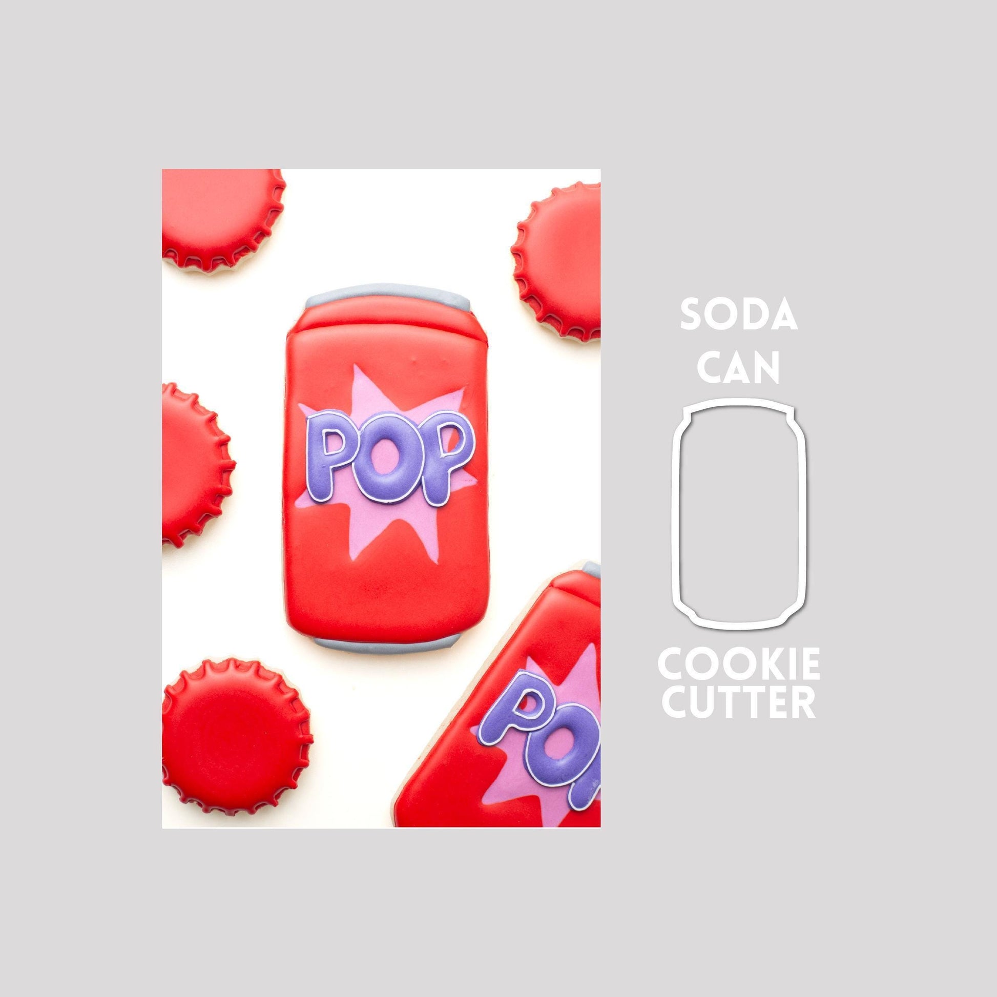 Decorated soda can sugar cookie next to a soda can cookie cutter outline on a gray background.