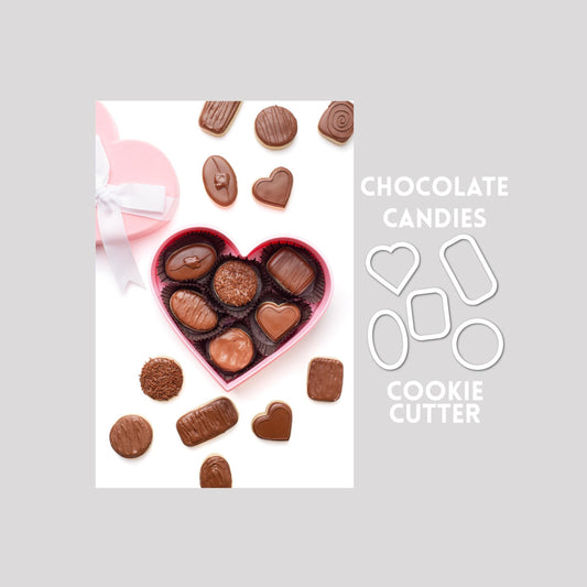 Decorated chocolate candies sugar cookies next to chocolate candies cookie cutter outlines on a gray background.
