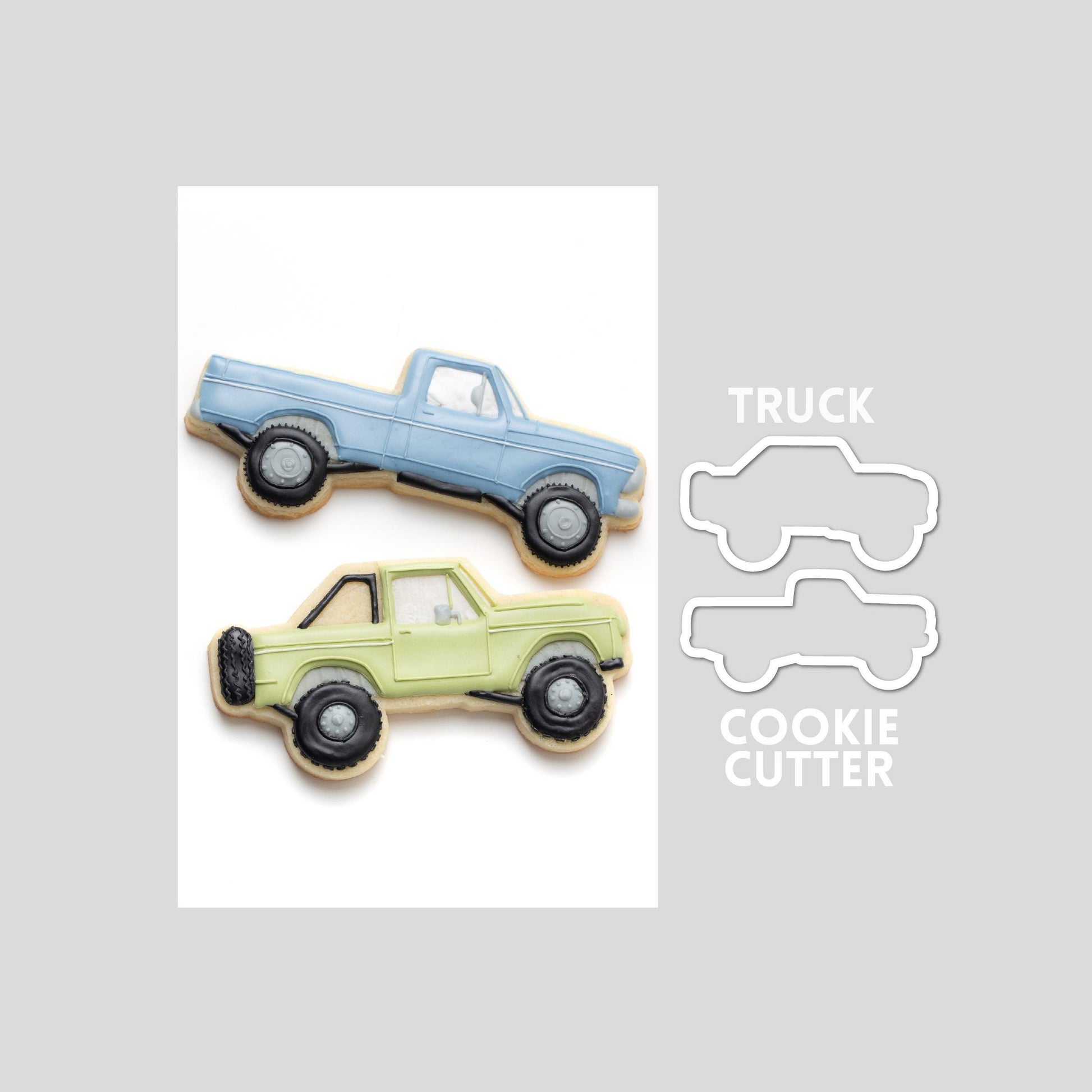 Decorated truck sugar cookie next to a truck cookie cutter outline on a gray background.