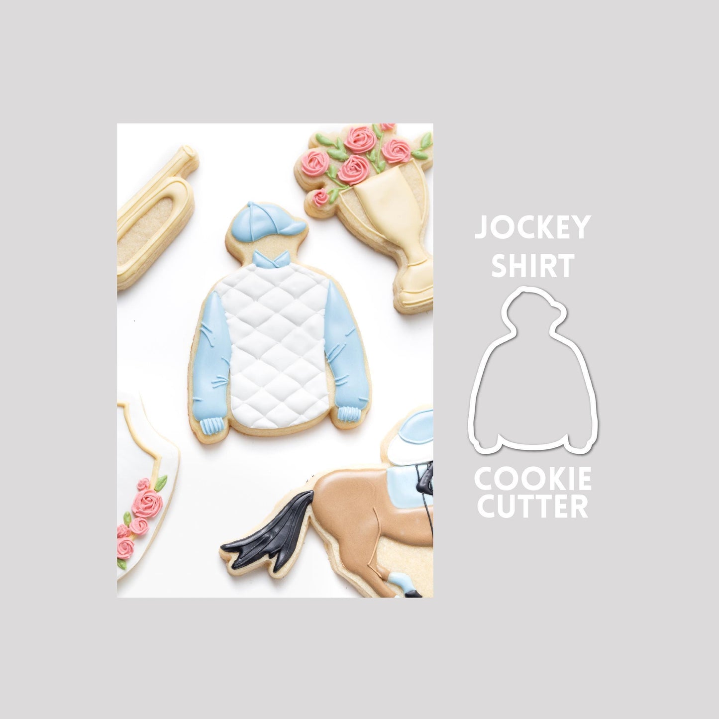 Decorated jockey shirt sugar cookie next to a jockey shirt cookie cutter outline on a gray background.