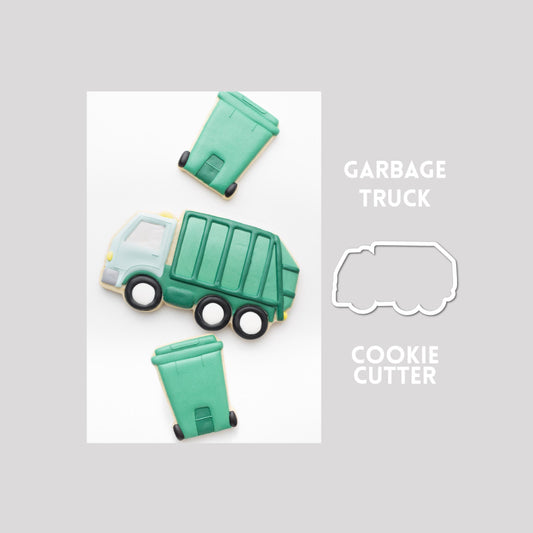 Decorated garbage truck sugar cookie next to a garbage truck cookie cutter outline on a gray background.