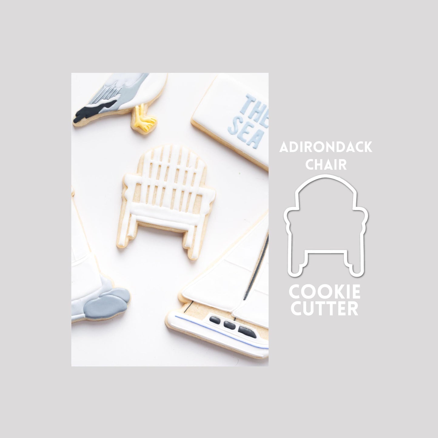 Decorated Adirondack chair sugar cookie next to a Adirondack chair cookie cutter outline on a gray background.