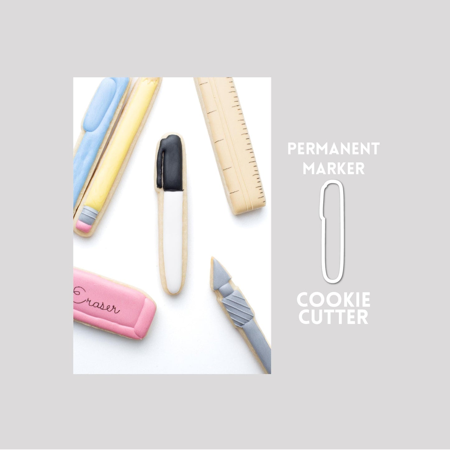 Decorated permanent marker sugar cookie next to a permanent marker cookie cutter outline on a gray background.