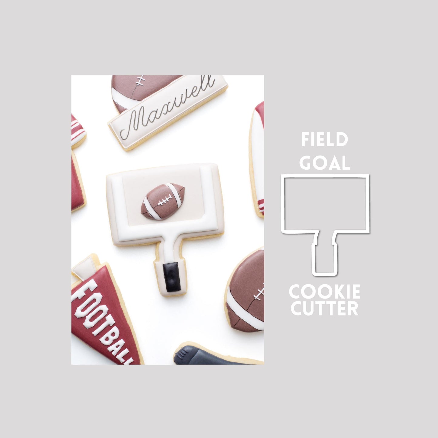 Decorated field goal sugar cookie next to a field goal cookie cutter outline on a gray background.