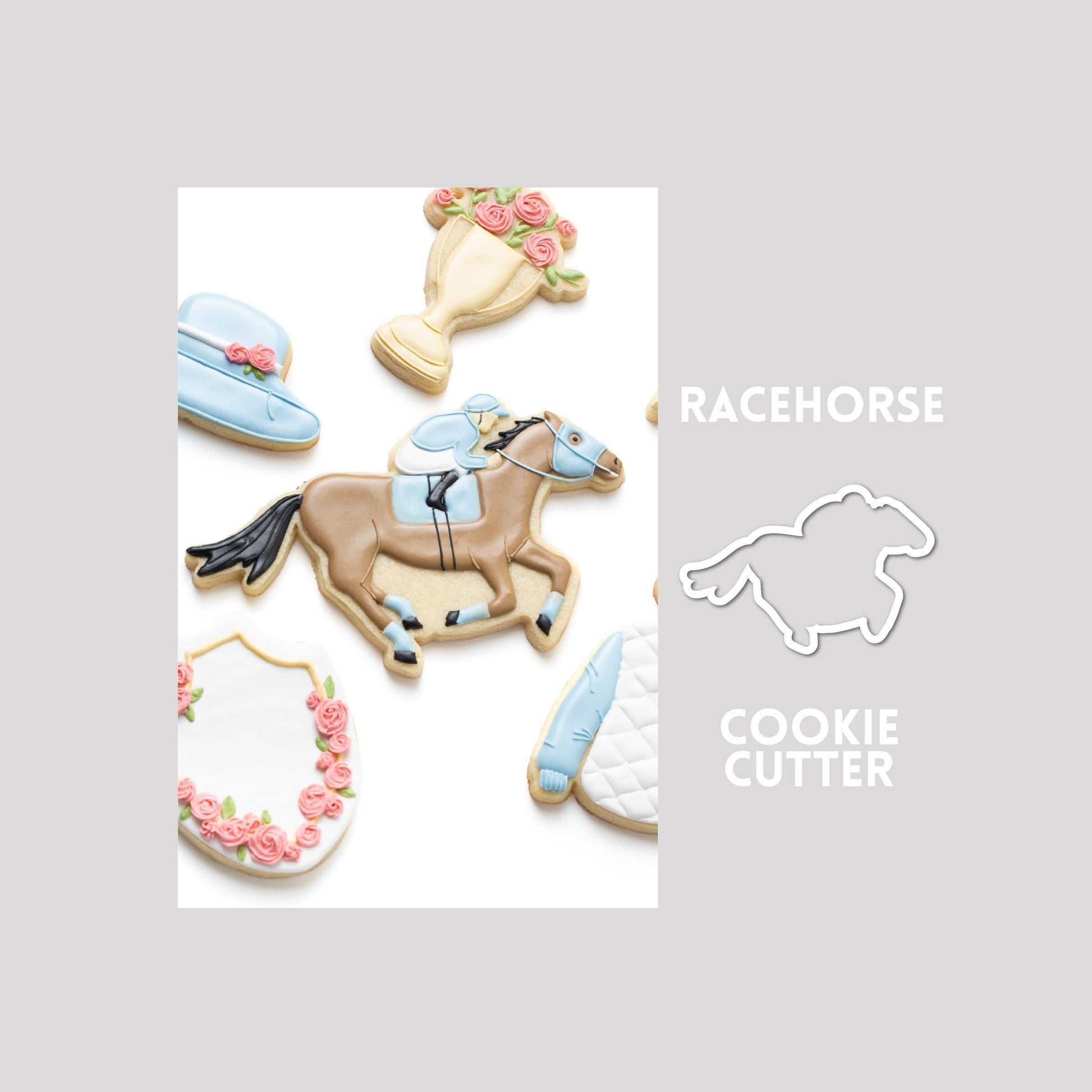 Decorated racehorse sugar cookie next to a racehorse cookie cutter outline on a gray background.