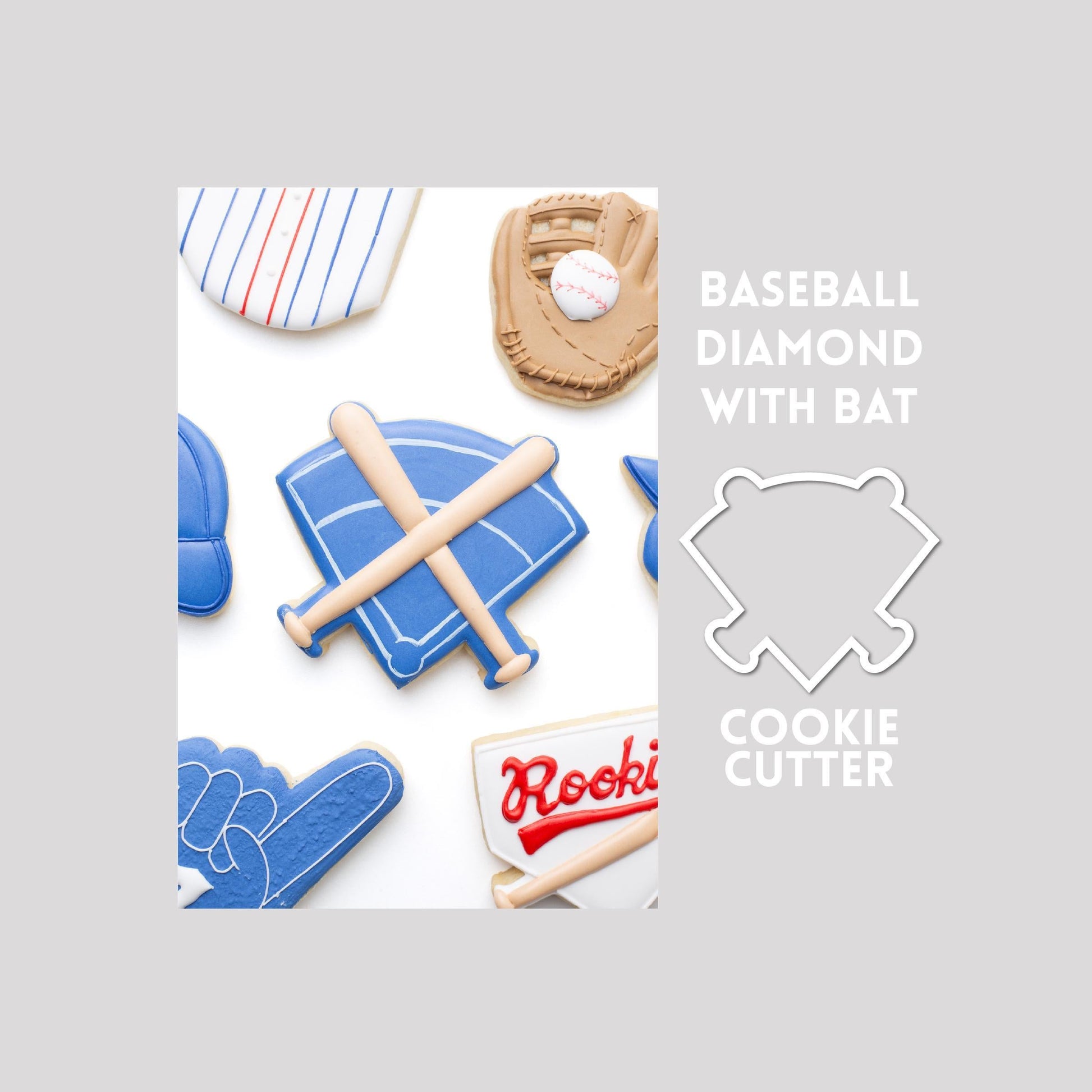 Decorated baseball diamond sugar cookie next to a baseball diamond cookie cutter outline on a gray background.
