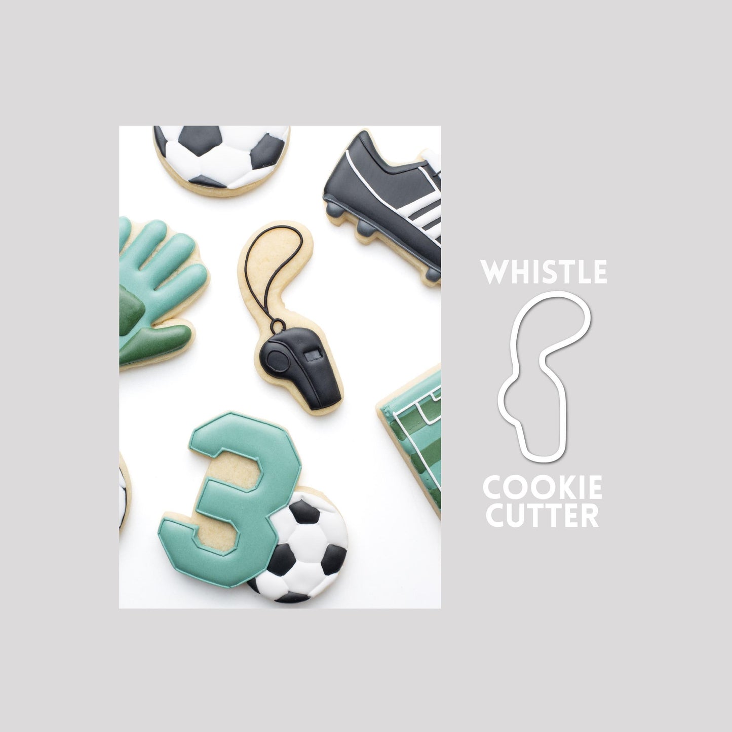 Decorated whistle sugar cookie next to a whistle cookie cutter outline on a gray background.