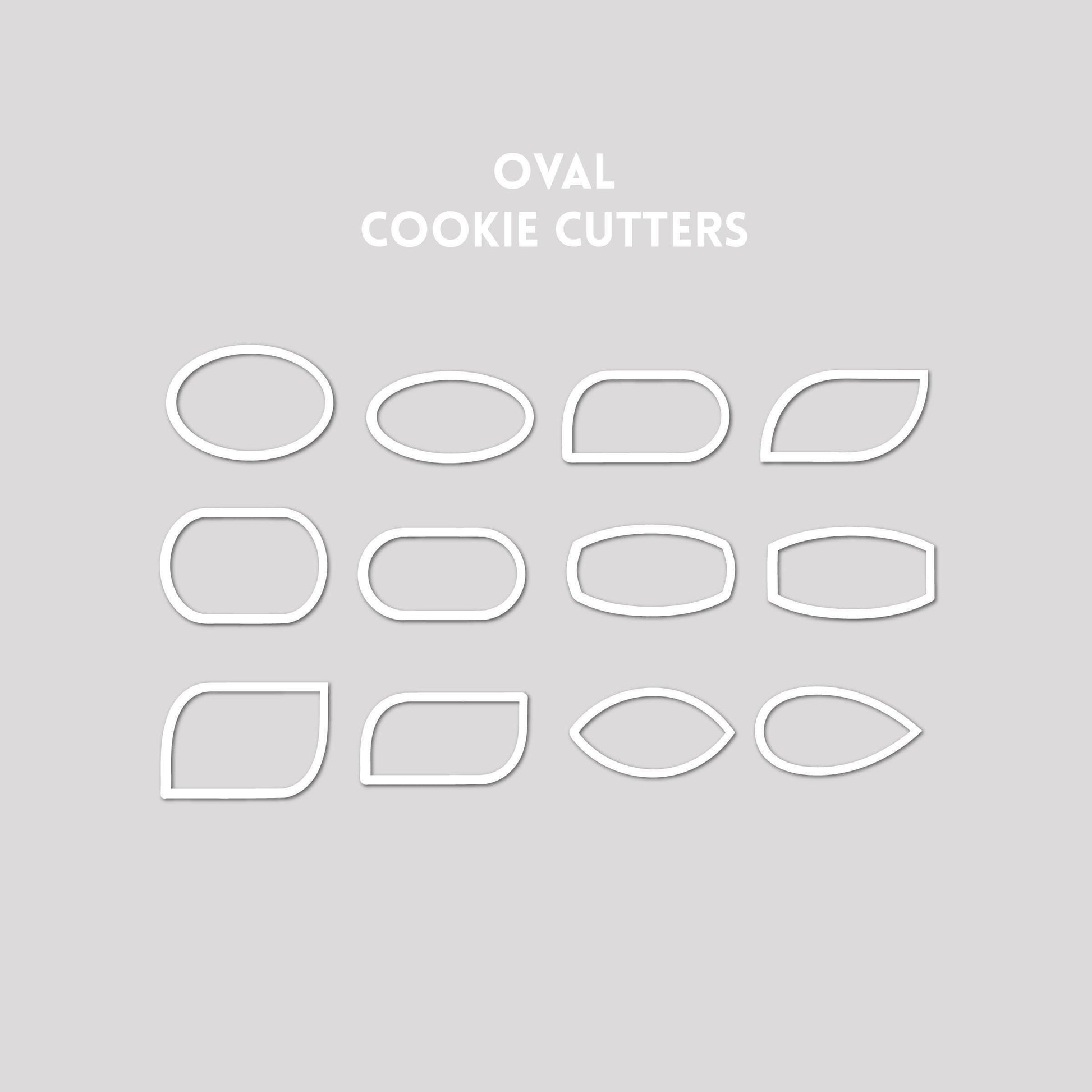 Various oval shaped cookie cutter outlines on a gray background.