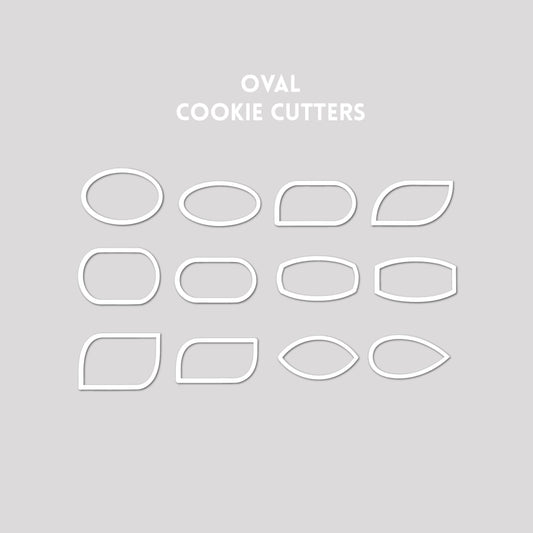 Various oval shaped cookie cutter outlines on a gray background.