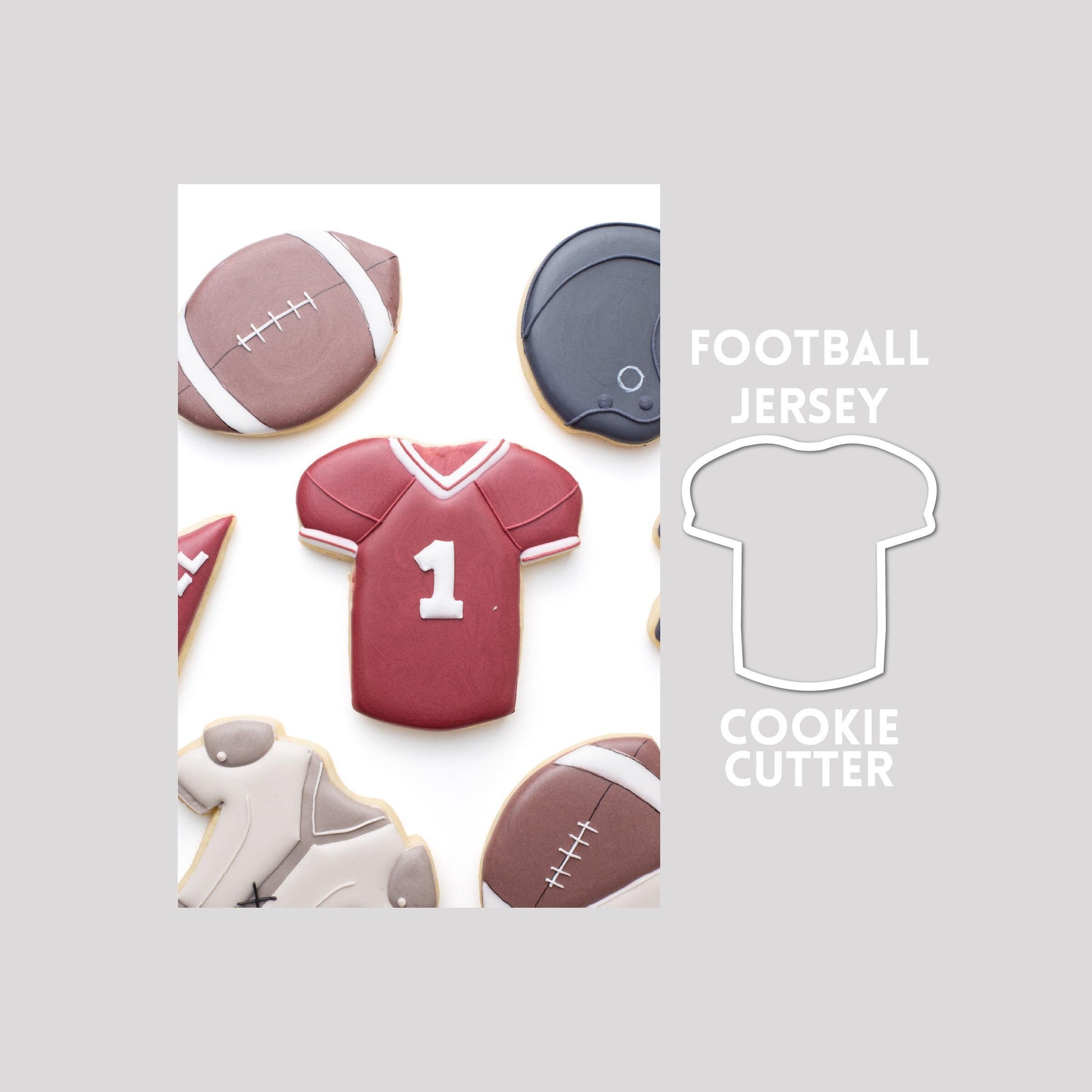 Decorated football jersey sugar cookie next to a football jersey cookie cutter outline on a gray background.