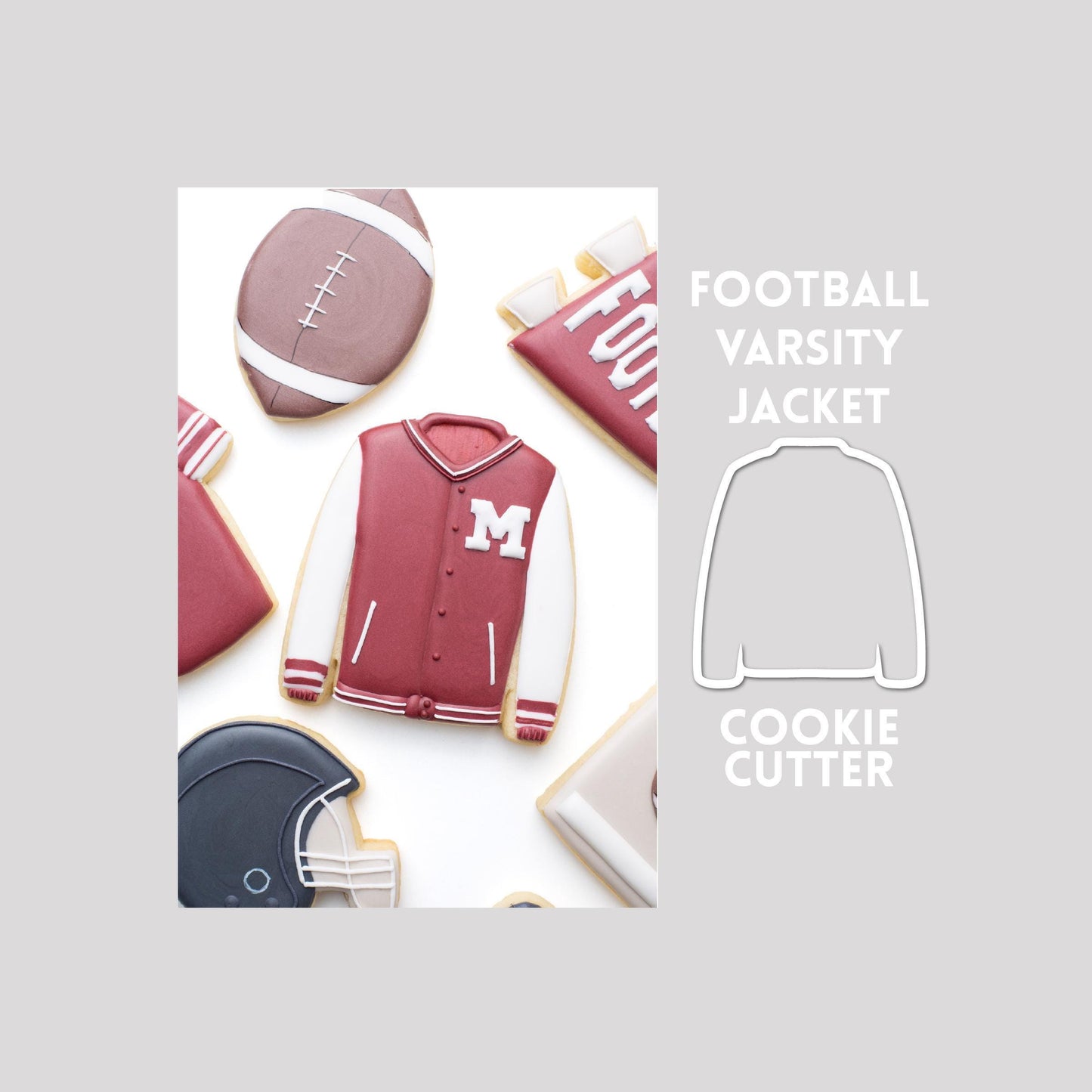 Decorated football varsity jacket sugar cookie next to a football varsity jacket cookie cutter outline on a gray background.