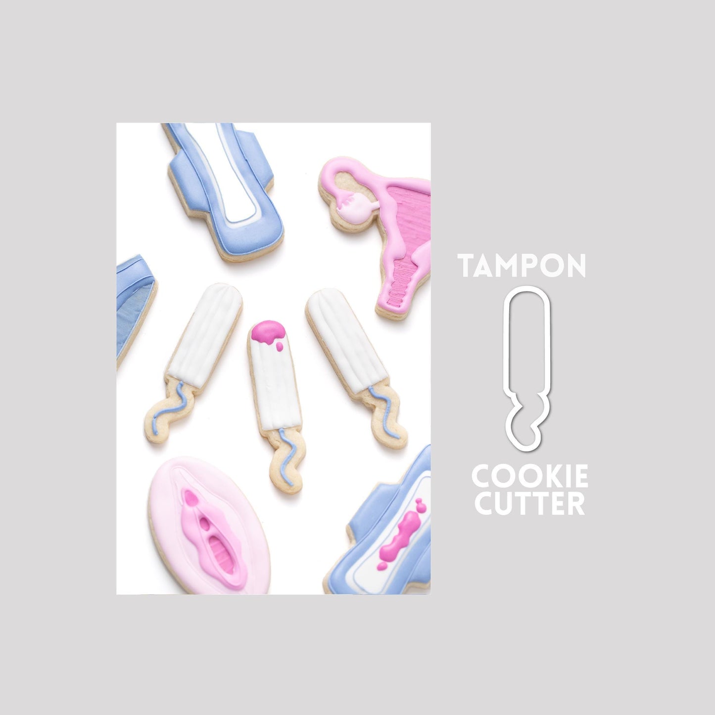 Decorated tampon sugar cookie next to a tampon cookie cutter outline on a gray background.