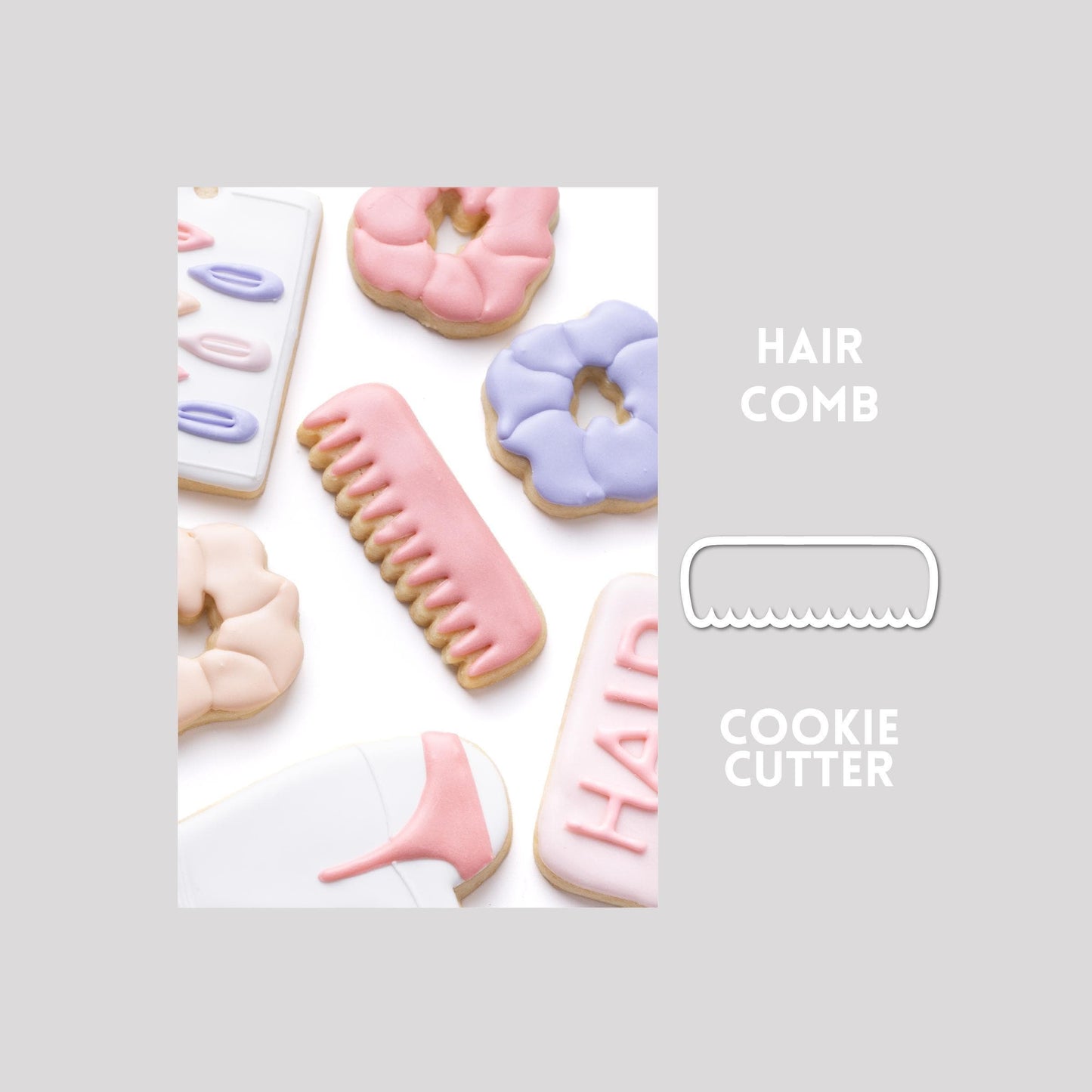 Decorated hair comb sugar cookie next to a hair comb cookie cutter outline on a gray background.
