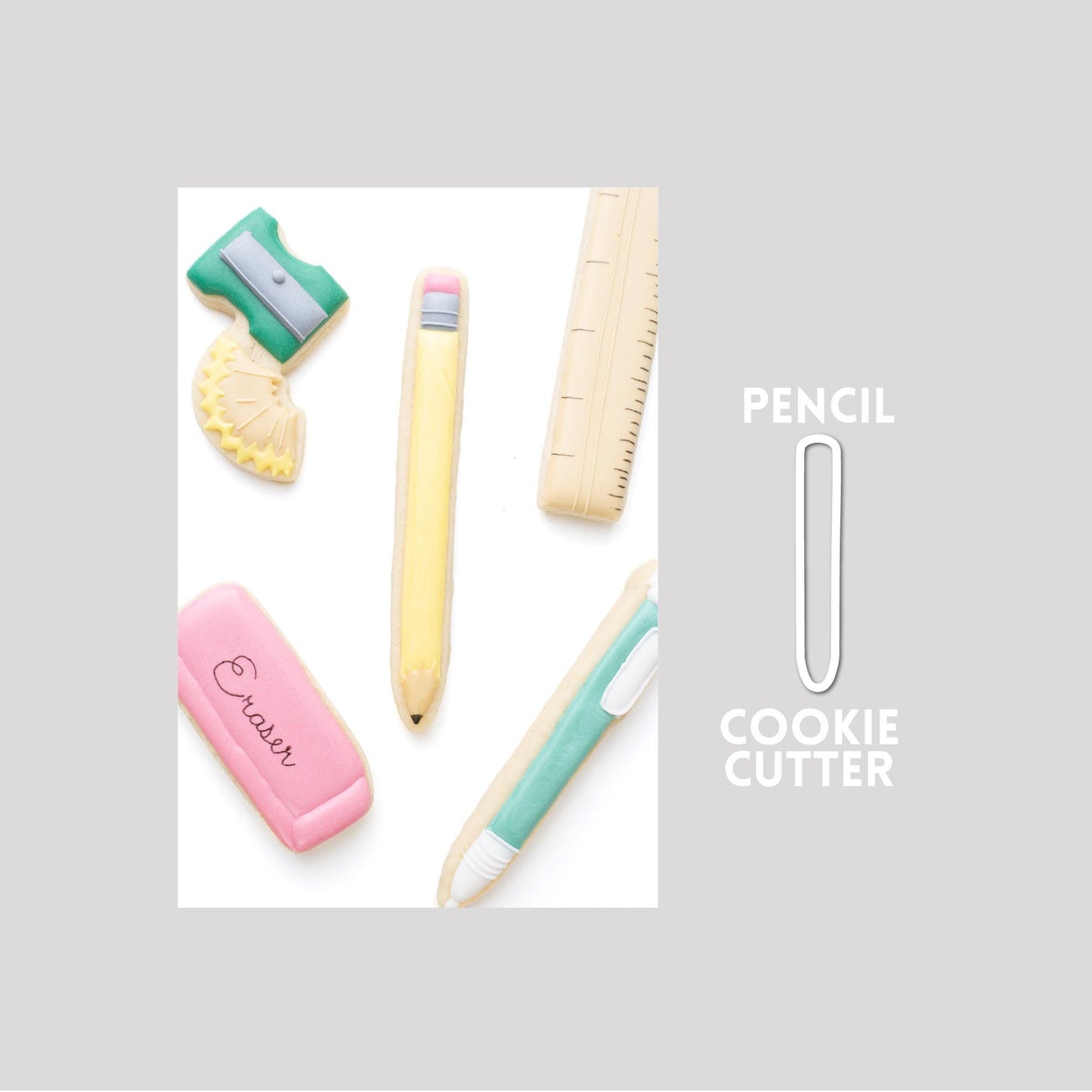 Decorated pencil sugar cookie next to a pencil cookie cutter outline on a gray background.