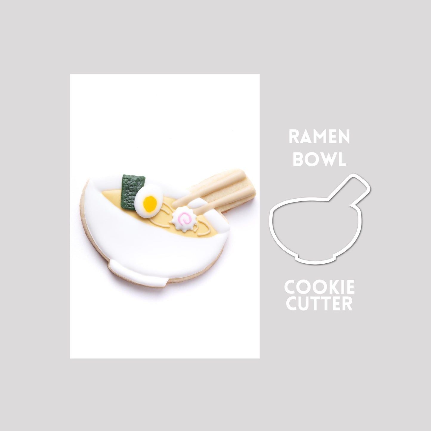 Decorated ramen bowl sugar cookie next to a ramen bowl cookie cutter outline on a gray background.