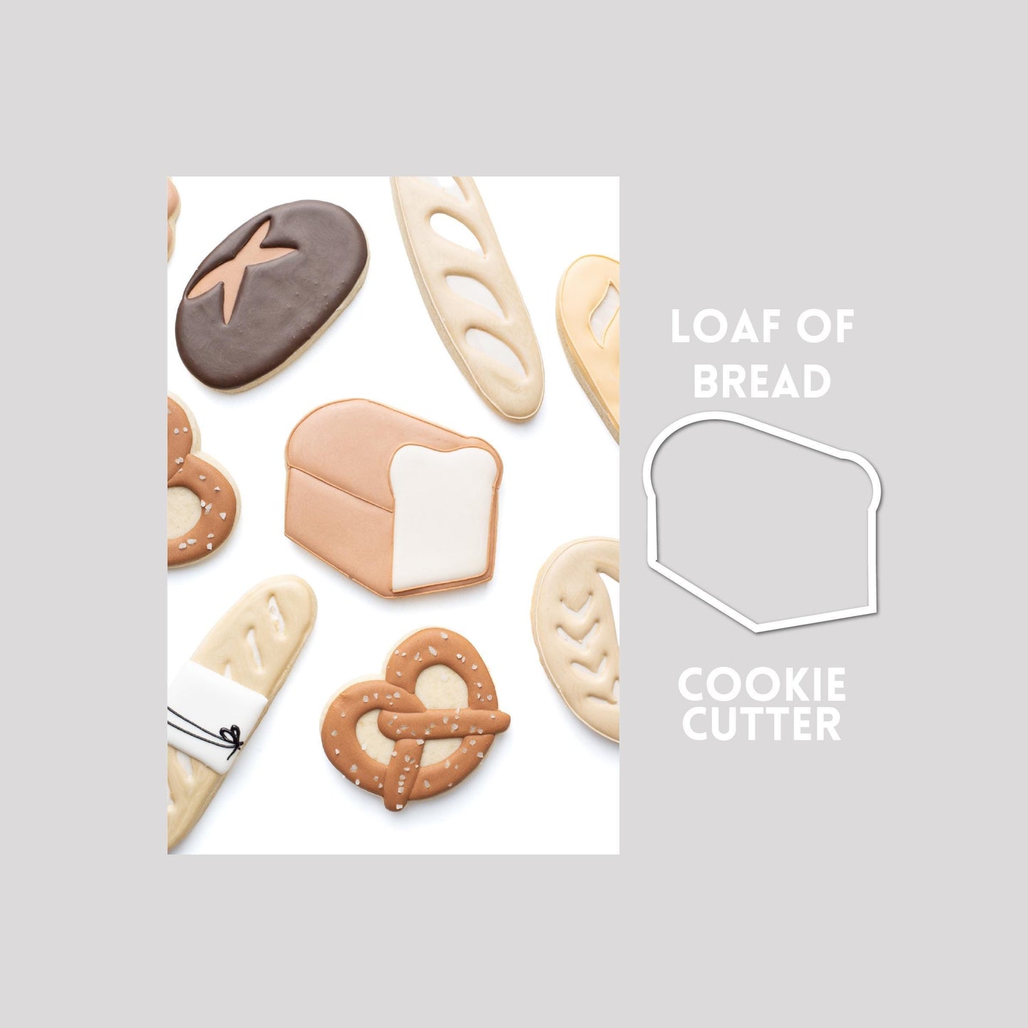 Decorated loaf of bread sugar cookie next to a loaf of bread cookie cutter outline on a gray background.