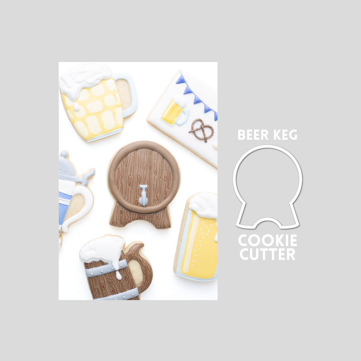 Decorated beer keg sugar cookie next to a beer keg cookie cutter outline on a gray background.