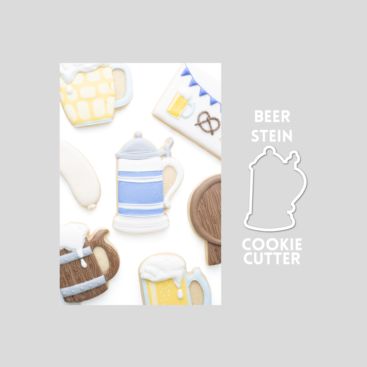Decorated beer stein sugar cookie next to a beer stein cookie cutter outline on a gray background.