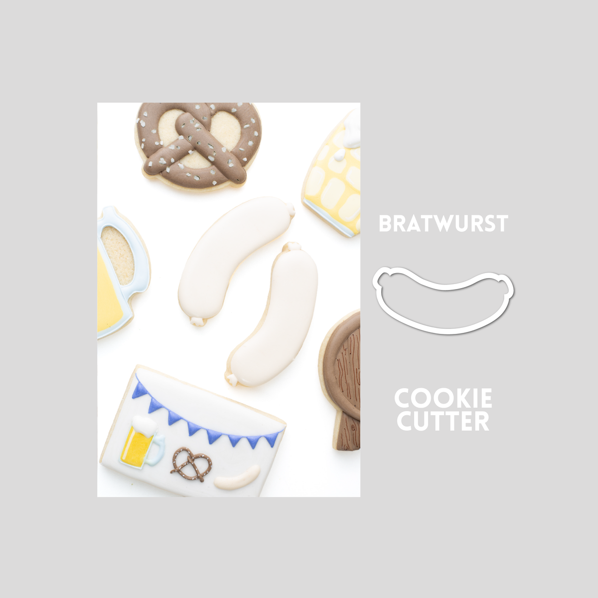 Decorated Bratwurst sugar cookie next to a Bratwurst cookie cutter outline on a gray background.