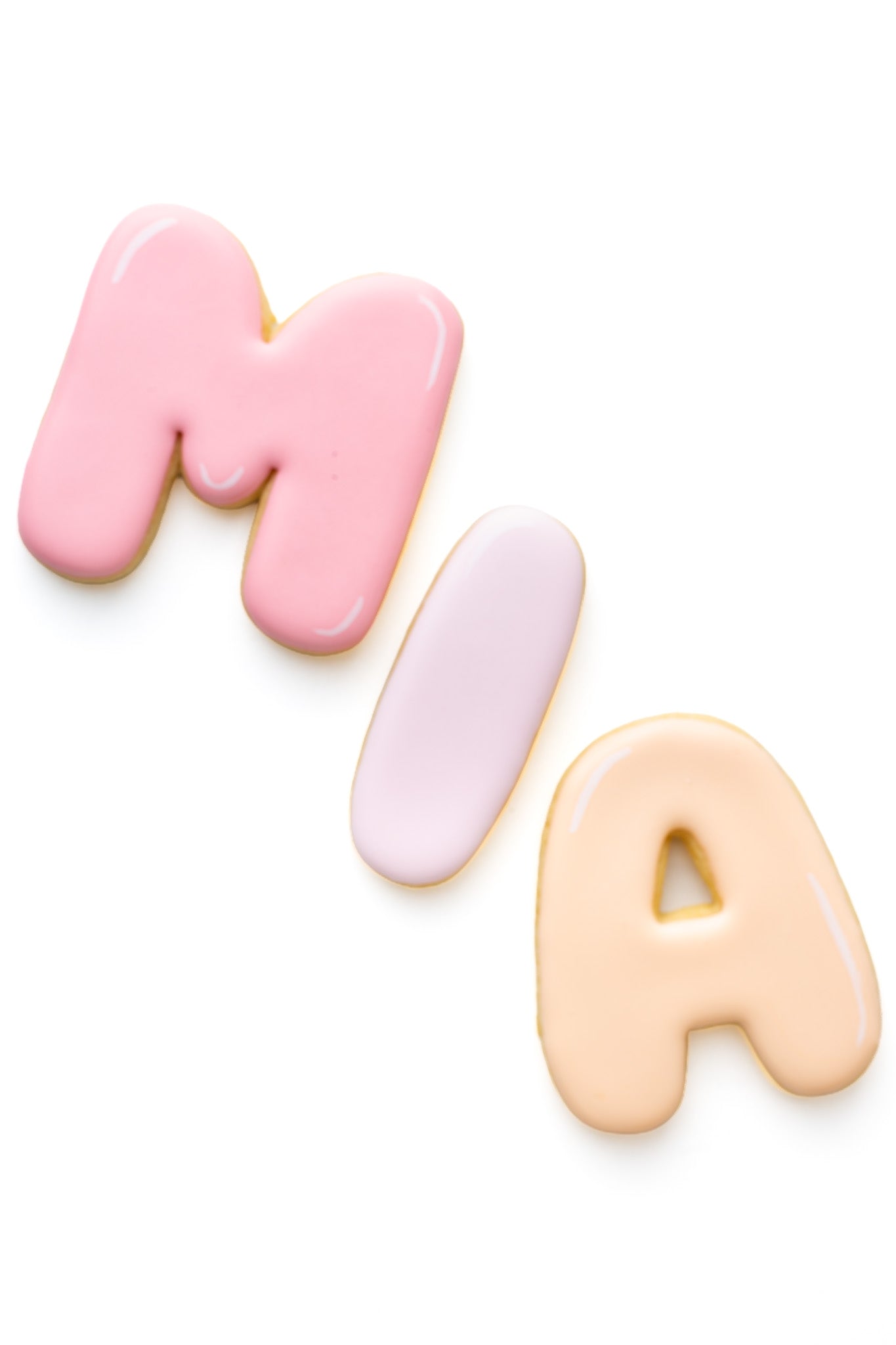 Decorated bubble letters sugar cookie spelling out the name MIA.