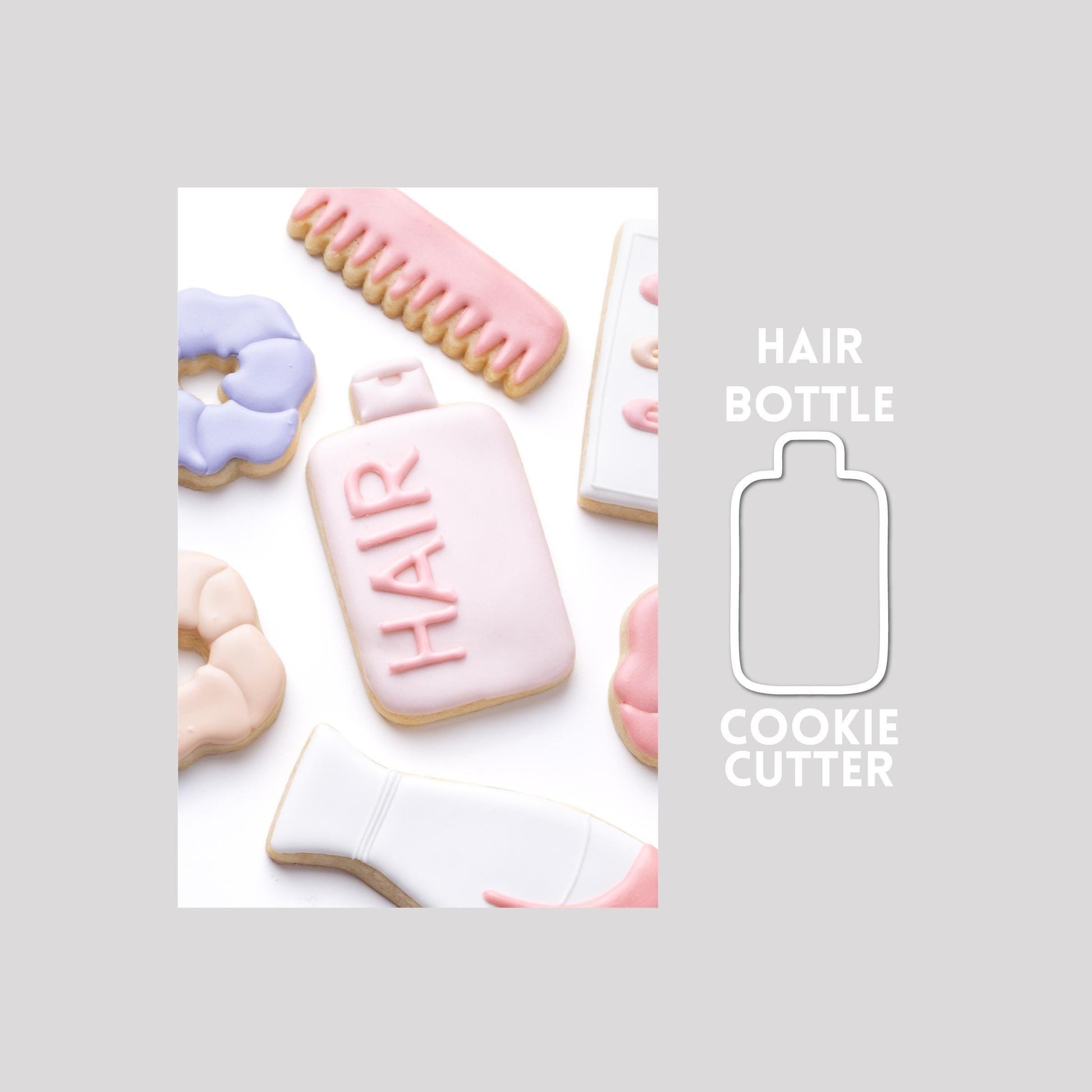 Decorated hair bottle sugar cookie next to a hair bottle cookie cutter outline on a gray background.