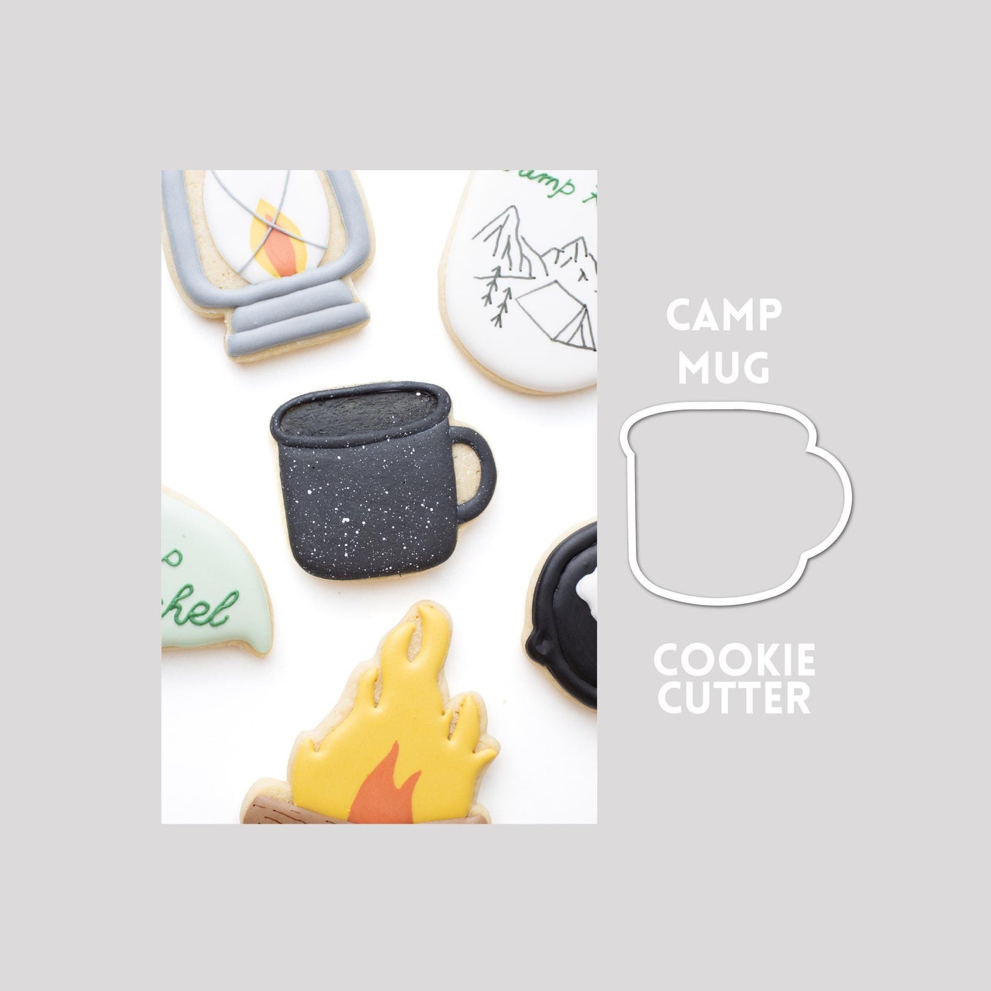 Decorated camp mug sugar cookie next to a camp mug cookie cutter outline on a gray background.