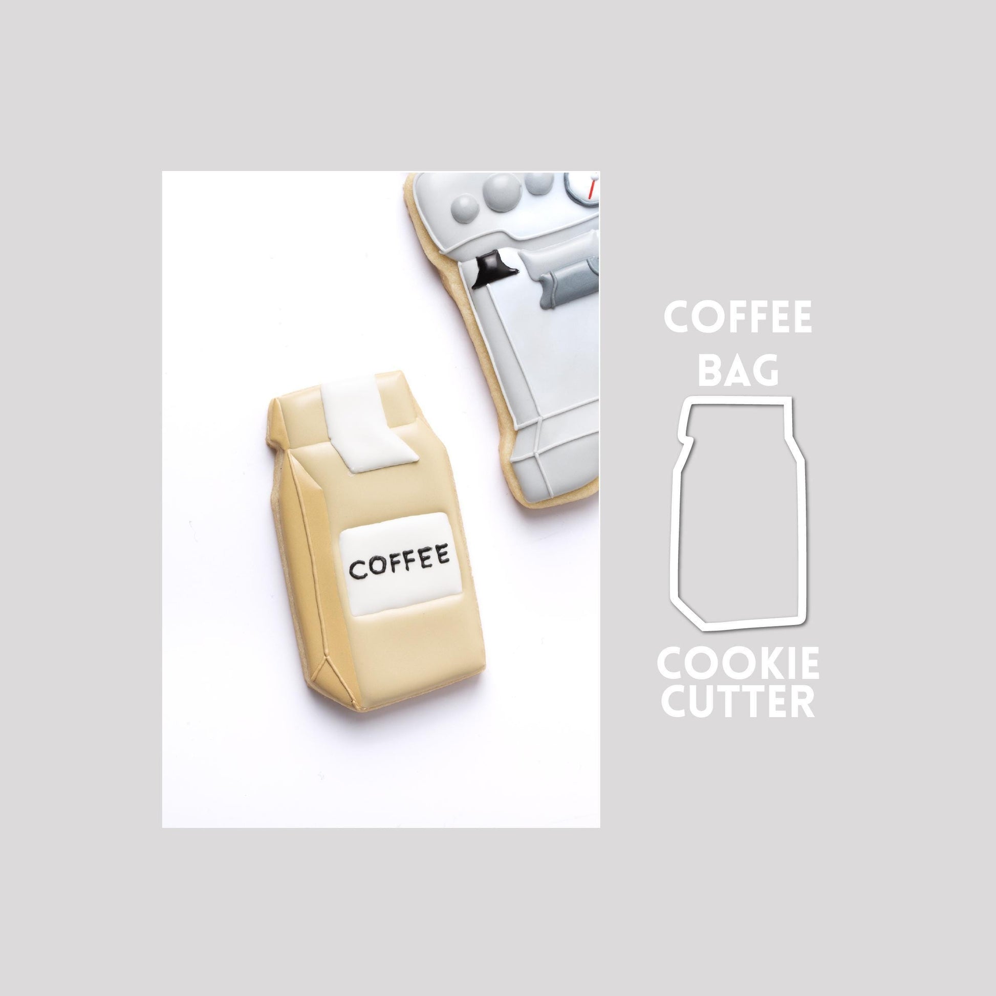 Decorated coffee bag sugar cookie next to a coffee bag cookie cutter outline on a gray background.