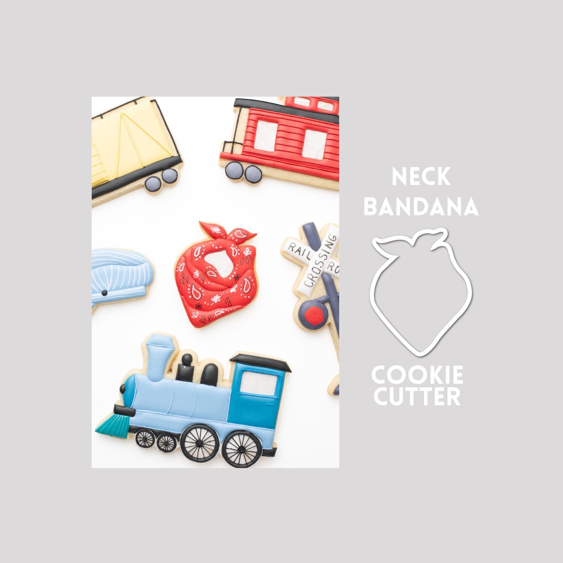 Decorated neck bandana sugar cookie next to a neck bandana cookie cutter outline on a gray background.