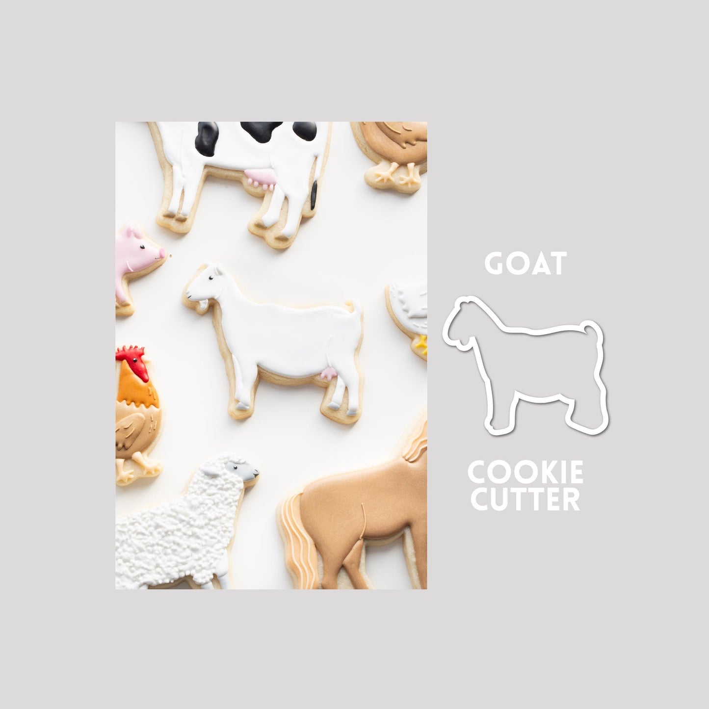 Decorated goat sugar cookie next to a goat cookie cutter outline on a gray background.