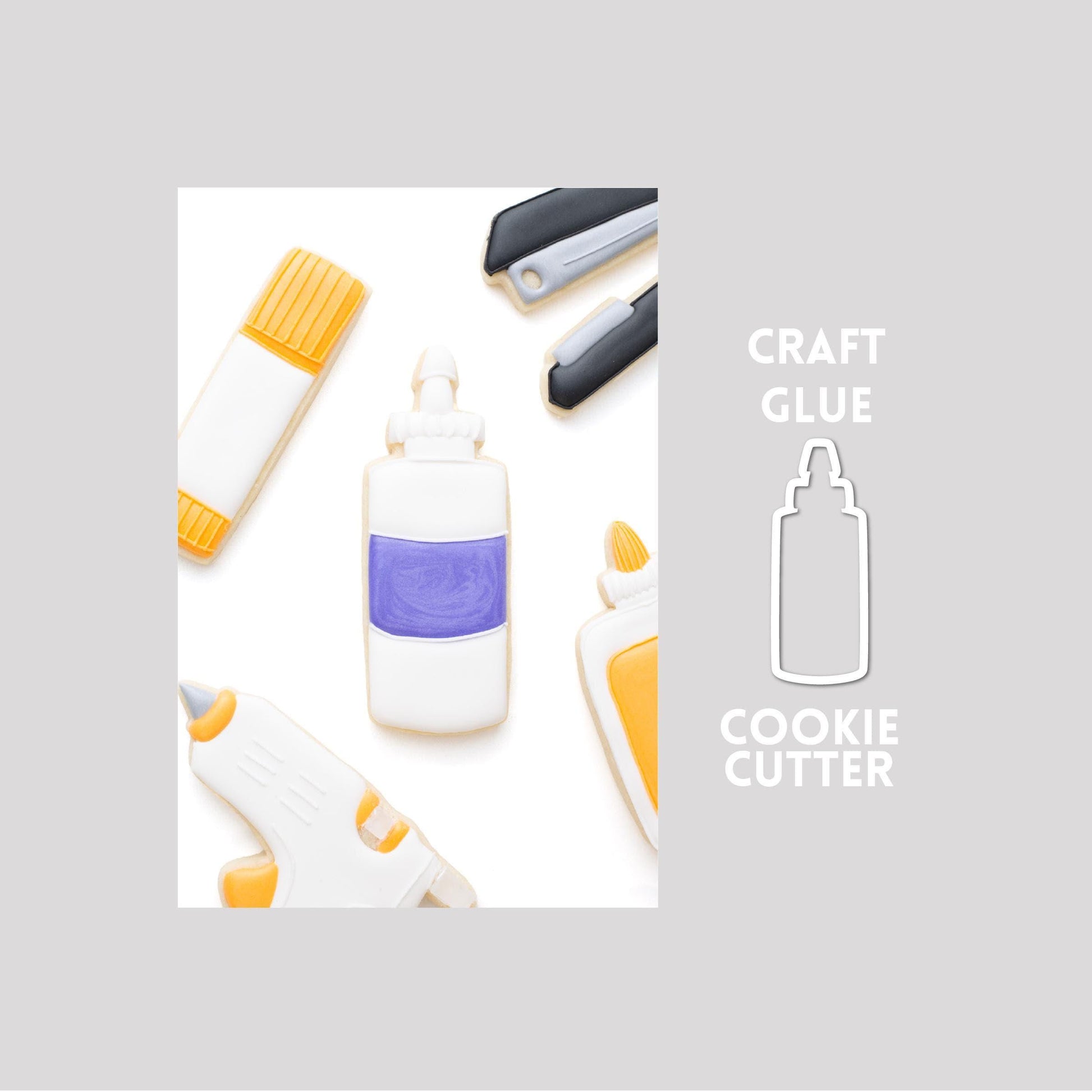 Decorated craft glue sugar cookie next to a craft glue cookie cutter outline on a gray background.