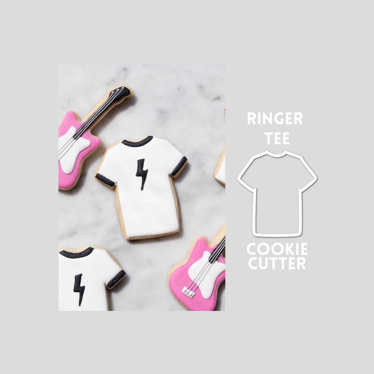 Decorated ringer tee sugar cookie next to a ringer tee cookie cutter outline on a gray background.