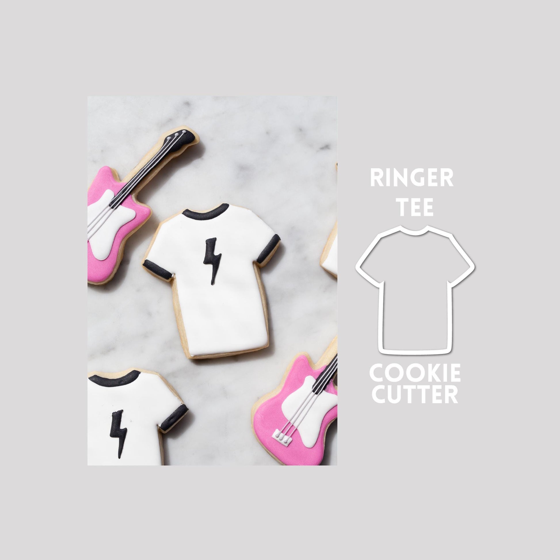 Decorated ringer tee sugar cookie next to a ringer tee cookie cutter outline on a gray background.