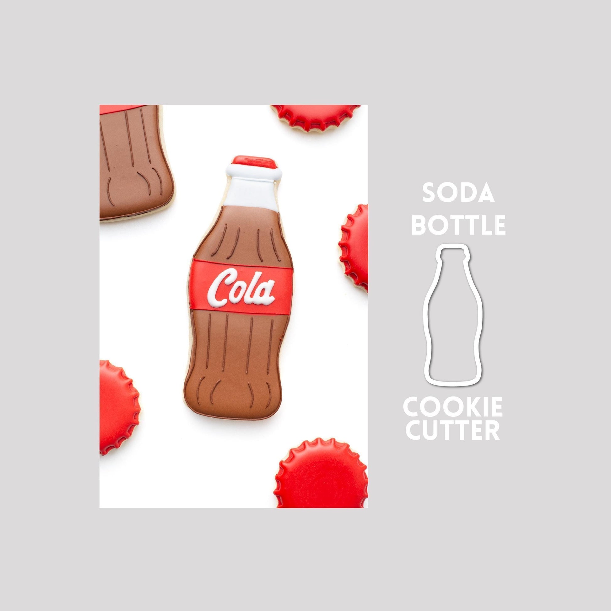 Decorated soda bottle sugar cookie next to a soda bottle cookie cutter outline on a gray background.