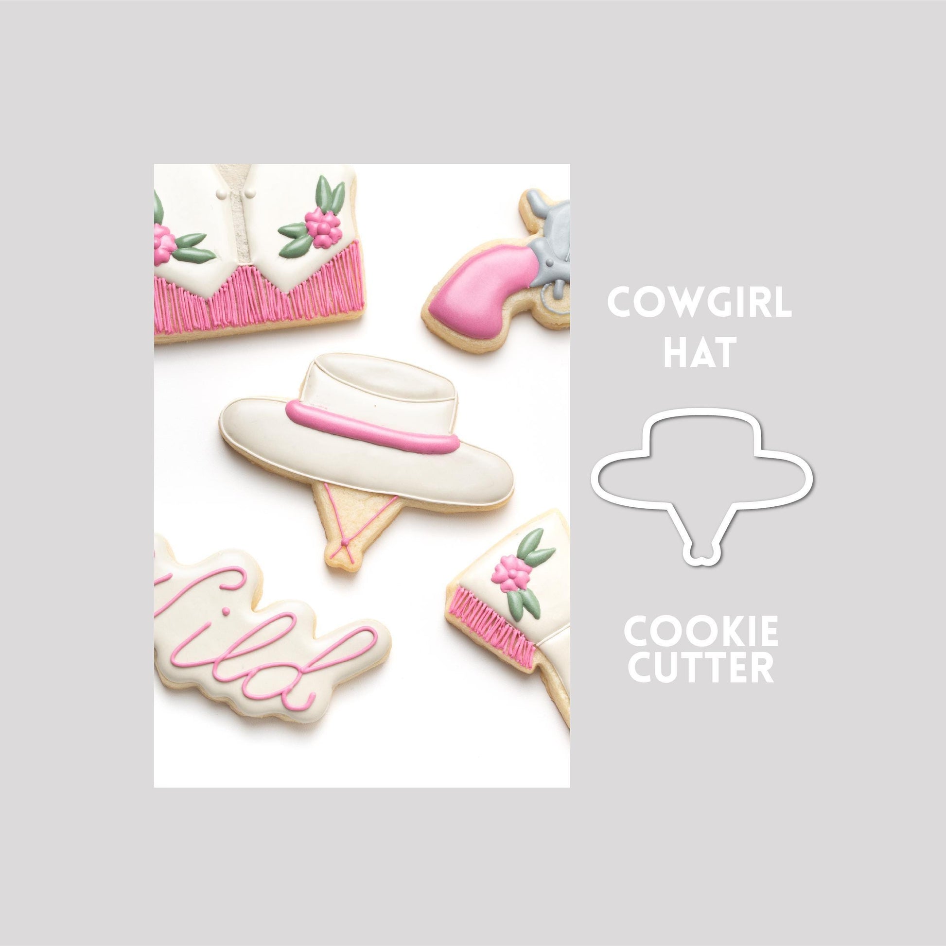 Decorated cowgirl hat sugar cookie next to a cowgirl hat cookie cutter outline on a gray background.