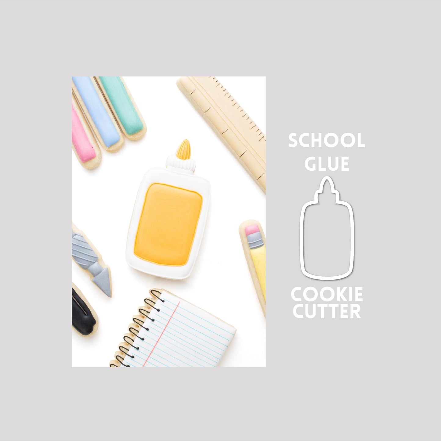 Decorated school glue sugar cookie next to a school glue cookie cutter outline on a gray background.