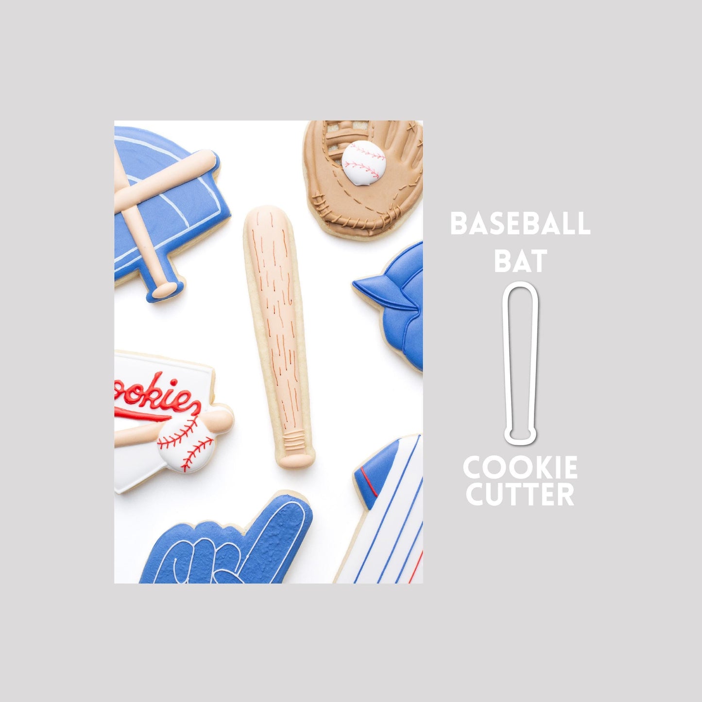 Decorated baseball bat sugar cookie next to a baseball bat cookie cutter outline on a gray background.