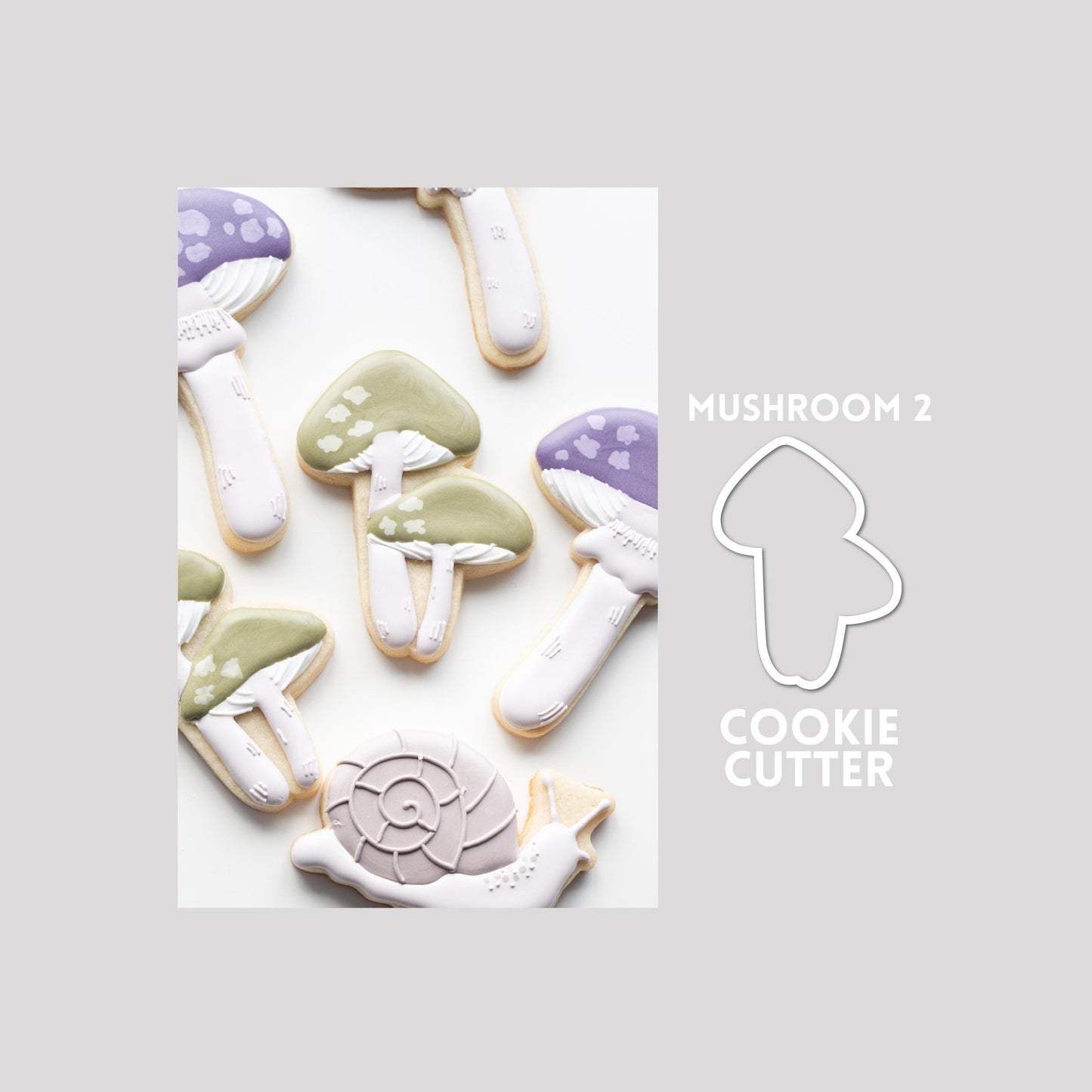 Decorated mushroom sugar cookie next to a mushroom cookie cutter outline on a gray background.