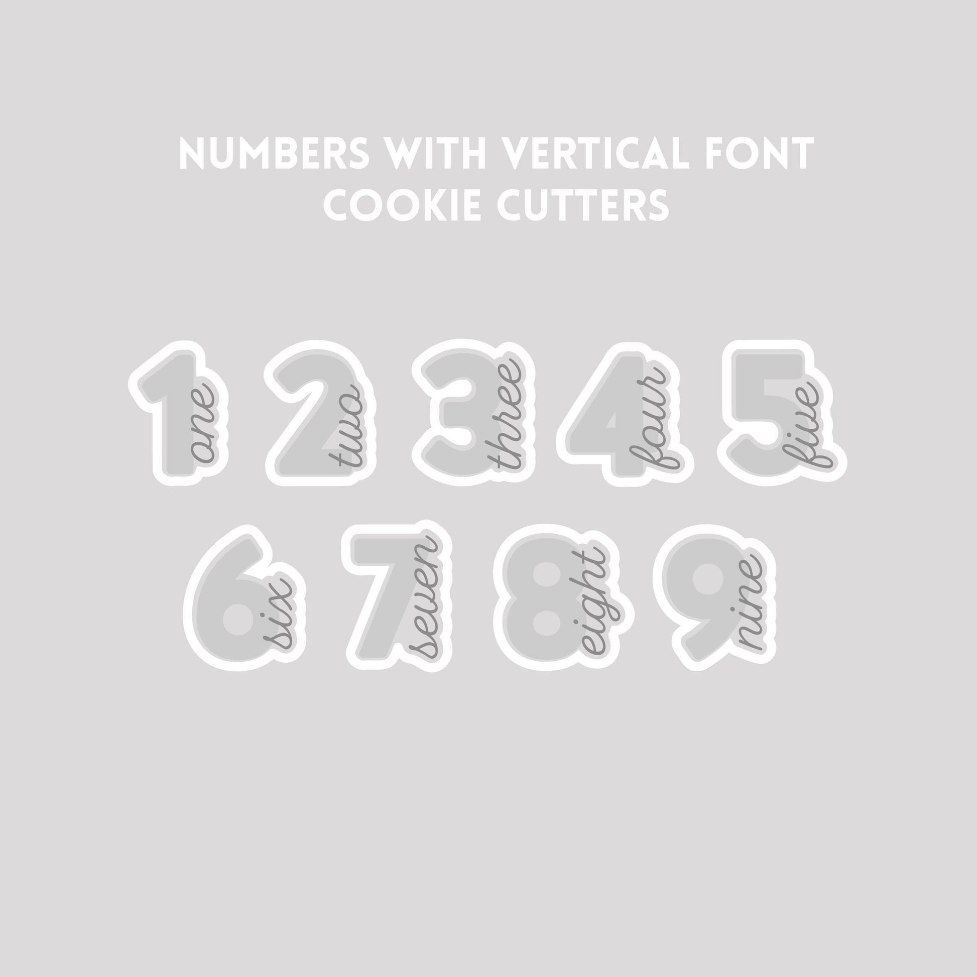 Various numbers with vertical font cookie cutter outlines on a gray background.