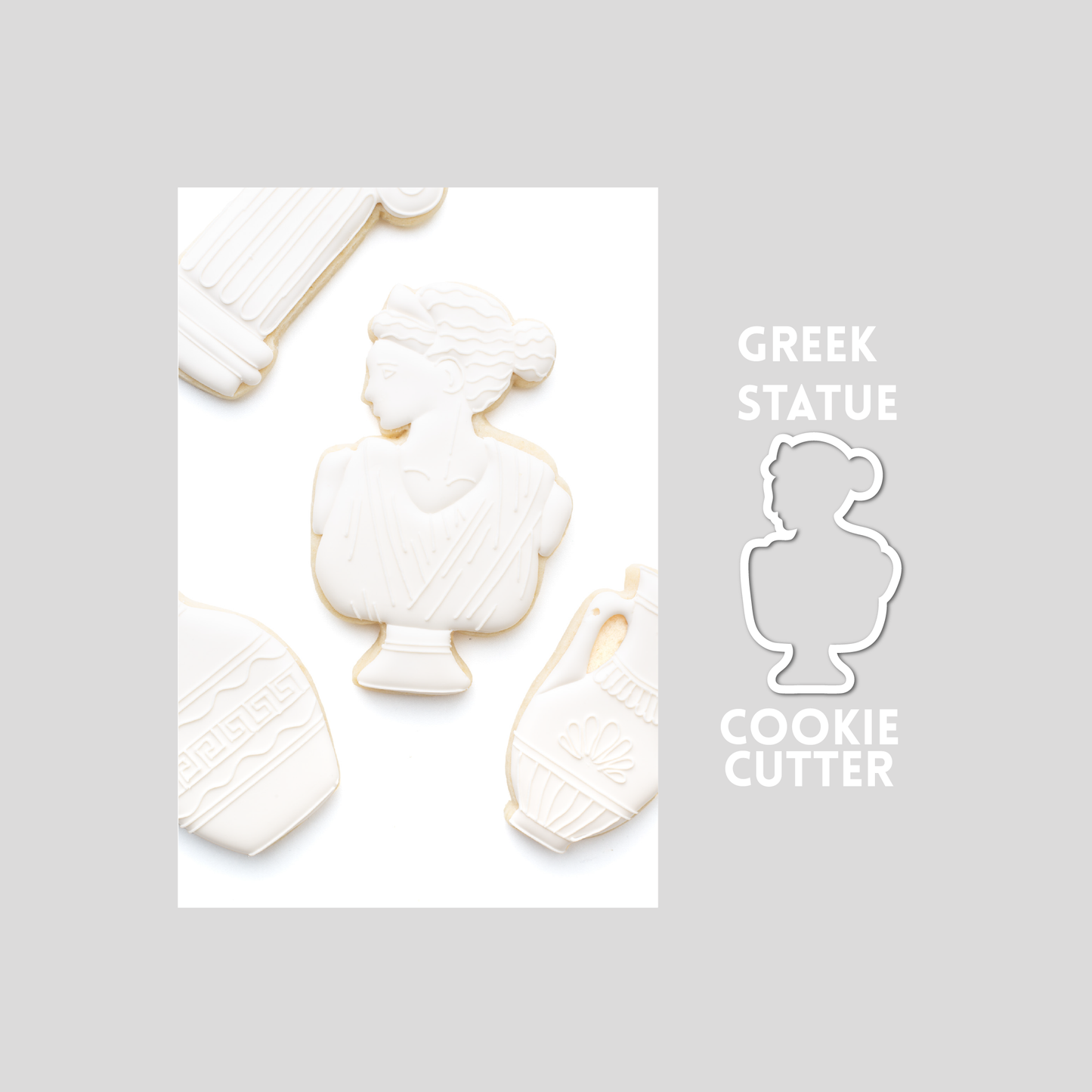 Decorated greek statue sugar cookie next to a greek statue cookie cutter outline on a gray background.